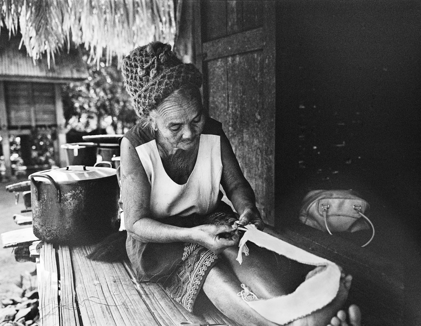 woman-cutting-fabric-luang-namtha-village